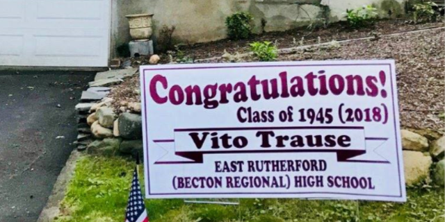 A "congratulations!" sign pictured outside of Vito Trause's New Jersey home. He graduated from Becton Regional (formerly known as East Rutherford when he was a student) High School on Wednesday night at 93 years old.