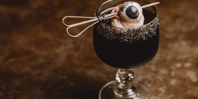 A new Australian restaurant is shocking customers with a Black Margarita, accented with feral pig eye and black salt rim.