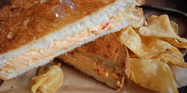 The Bayou Bakery uses a 10 percent cream cheese to 90 percent New York sharp cheddar cheese mix, with fresh roasted pimentos when in season.