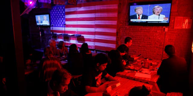 Customers watch the third presidential debate at the Pinche Gringo BBQ restaurant in Mexico City, on Oct. 19, 2016.