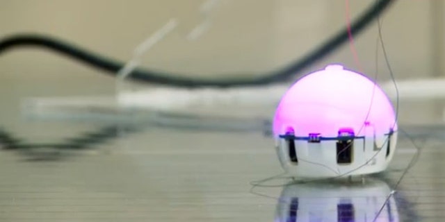 A ping-pong ball sized robot, designed to join with its mates and self-assemble.