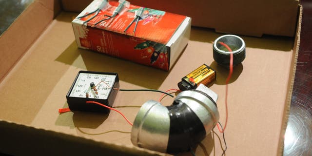 A mock-up of a pipe bomb is displayed by authorities at City Hall in New York.
