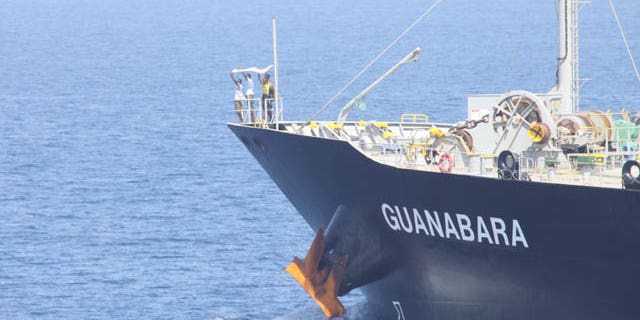 March 6: Suspected pirates indicate their surrender on the bow of Japanese-owned commercial oil tanker M/V Guanabara. Combined Maritime Forces warship USS Bulkeley, with support from Turkish warship TCG Giresun of NATO’s counter-piracy Task Force 508, responded to the reported pirating of Guanabara, which resulted in the detention of the four suspected pirates and freeing of 24 crew members. (U.S. Navy)