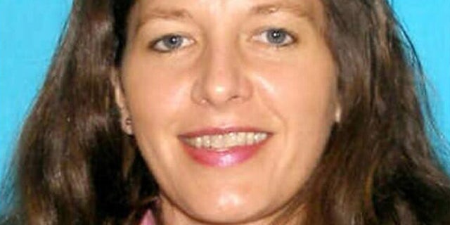 March 8, 2013: This undated image released by the Seattle police shows 46-year-old Carolyn Piksa, who authorities say is suspected of critically wounding a 65-year-old man in a Seattle parks department building. She was arrested at her home Friday, hours after fleeing the scene of the shooting. (AP/Seattle Police)