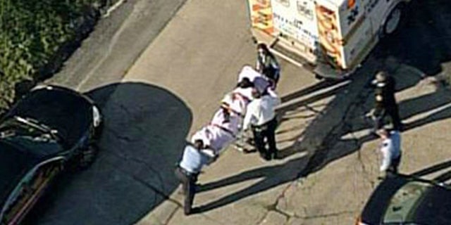 Nov. 13, 2013: In this aerial image provided by KDKA-TV, a person is loaded into an ambulance near Brashear High School in Pittsburgh.