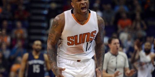 Feb 27, 2016; Phoenix, AZ, USA; Phoenix Suns forward P.J. Tucker (17) celebrates against the Memphis Grizzlies during the second half at Talking Stick Resort Arena. The Suns won 111-106. Mandatory Credit: Joe Camporeale-USA TODAY Sports