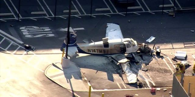 July 30, 2014: The wreckage of a small plane is shown in a Costco parking lot in San Diego. (Courtesy Fox5SanDiego.com)