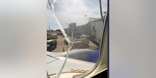 A Southwest Airlines flight made an emergency landing in Cleveland after a window broke.