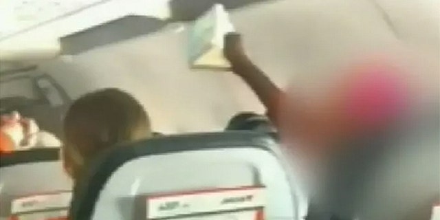 Witnesses told 9News that the woman began singing and chanting so loudly that children began to cry.