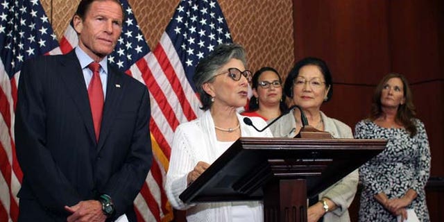 Aug. 3, 2015: Sen. Barbara Boxer, D-Calif., speaks to reporters in defense of Planned Parenthood as Sens. Richard Blumenthal, D-Conn., left, and Mazie Hirono, D-Hawaii, right, listen.