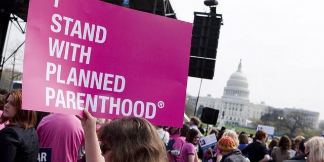 FILE: In this April 7, 2011, photo, members of Planned Parenthood, NARAL Pro-Choice America and more than 20 other organizations hold a "Stand Up for Women's Health" rally in support of preventive health care and family planning services, including abortion, in Washington.