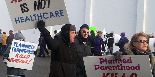 Abortion opponents rally outside Planned Parenthood in St. Paul, Minn., on Saturday.