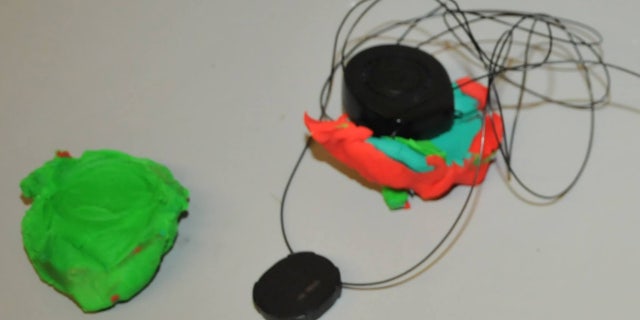 The Play-Doh was used to attempt to cover a security device.
