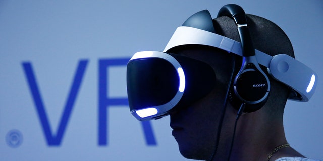 File photo - A visitor plays a game on a PlayStation VR at the Paris Games Week, a trade fair for video games in Paris, France, Oct. 28, 2015. (REUTERS/Benoit Tessier)