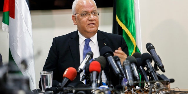 Saeb Erekat speaks to reporters in Ramallah Wednesday.