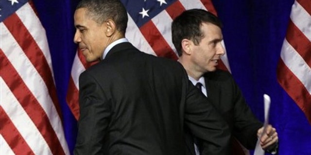President Obama is introduced by senior adviser David Plouffe before he speaks at a Democratic National Committee event in Washington March 16.