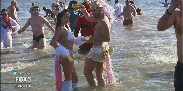 Frigid temperatures did not faze the Coney Island Polar Bear Club, who braved the sub-zero wind chills to sprint into the ocean New Year’s Day.