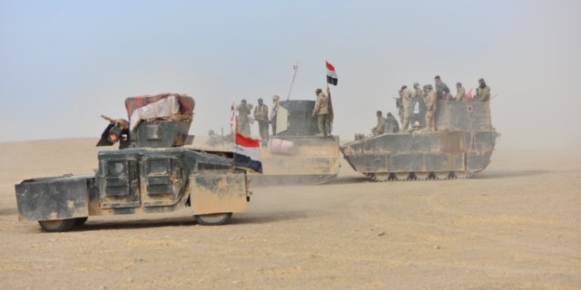 PMF fighters work alongside Iraqi Forces, prompting concern they may access U.S-issued equipment.