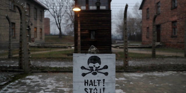 A sign reading "Stop!" in German and Polish is seen at the former Nazi German concentration and extermination camp Auschwitz.