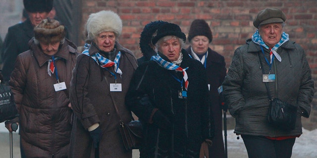 Holocaust survivors commemorate the people killed by the Nazis at the former Auschwitz Germany Nazi death camp in Oswiecim, Poland, Friday, Jan. 27, 2017, on the International Holocaust Remembrance Day that marks the liberation of the Auschwitz Nazi death camp on Jan. 27, 1945. (AP Photo/Czarek Sokolowski)