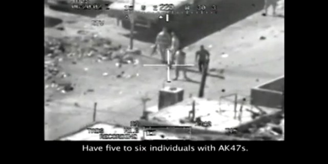 This frame grab image, taken from a video posted at Wikileaks.org, shows a group of men in the streets of the New Baghdad with weapons just prior to being fired upon by a U.S. Army Apache helicopter July 12, 2007. (FNC)