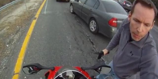 Motorcyclist Anthony Graber drew national attention when he posted a video in March showing plainclothes Maryland State Trooper Joseph D. Uhler with his gun drawn pulling him over on a speeding and reckless driving violation. (YouTube)