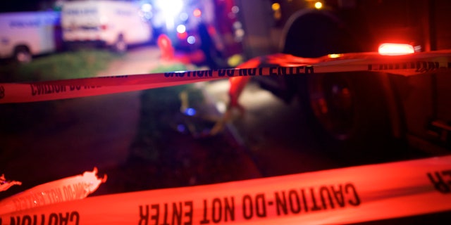 PHILADELPHIA, PA - MAY 12: Police tape blocks the area near the wreckage of an Amtrak passenger train carrying more than 200 passengers from Washington, DC to New York that derailed May 12, 2015 in north Philadelphia, Pennsylvania. At least five people were killed and more than 50 others were injured in the crash. (Photo by Mark Makela/Getty Images)