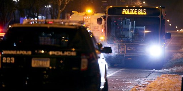 Dec. 3, 2015: Minneapolis Police make their way around the 4th Precinct after they cleared the protesters and their encampment in Minneapolis.