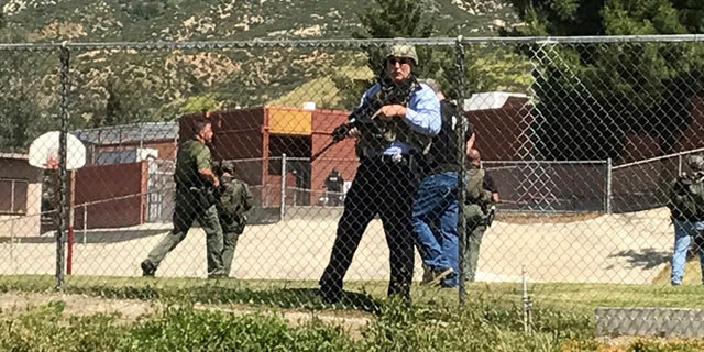 Emergency personnel respond to a shooting inside North Park School Elementary School on Monday, April 10, 2017, in San Bernardino, Calif. (Rick Sforza/Los Angeles Daily News via AP)