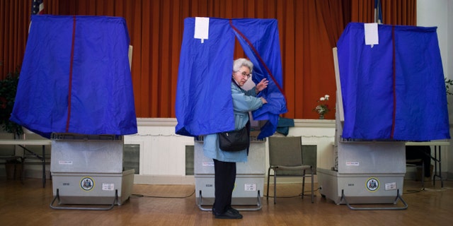 PHILADELPHIA, PA - APRIL 24: Lilyan Maitan stands in a voting booth during the Republican primary election April 24, 2012 at St. George Greek Orthodox Church in Philadelphia, Pennsylvania. Turnout is expected to be low as Former Massachusetts Gov. Mitt Romney continues his campaign as the presumptive GOP candidate. (Photo by Jessica Kourkounis/Getty Images)