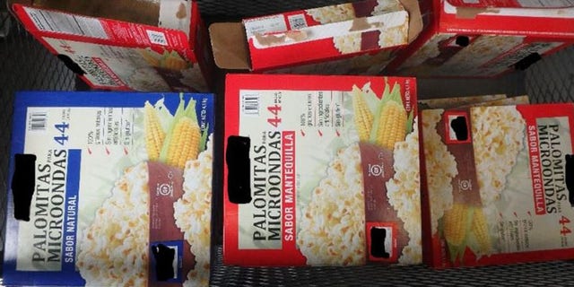 CBP officers found 15 packages of meth hidden inside boxes of popcorn.