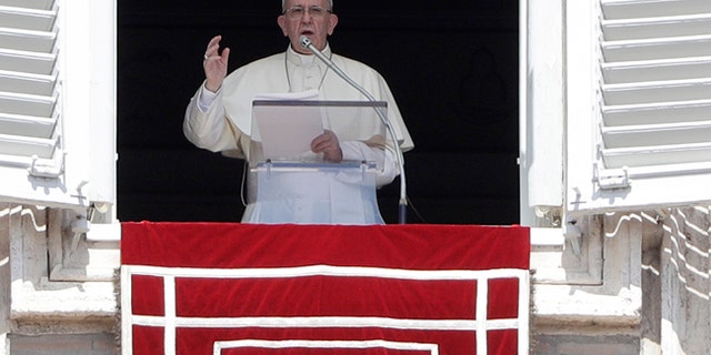 Pope Francis delivers his blessing as he recites the Angelus noon prayer in St. Peter's Square at the Vatican, Sunday, Sept. 3, 2017. (AP Photo/Gregorio Borgia)