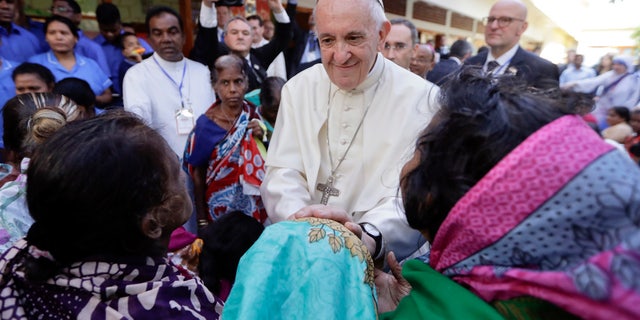 Pope Francis meets with sick people and staff of the Mother Teresa House in Dhaka's Tejgaon neighborhood, Bangladesh, Dec. 2, 2017.