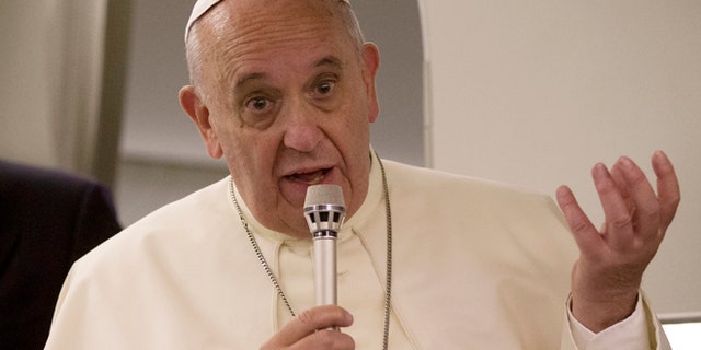 May 26, 2014: Pope Francis talks to journalists during a press conference he held aboard the papal flight on his way back to Rome at the end of a three day trip to the Middle East.