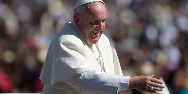 Pope Francis waves from his popemobile as he arrives in San Cristobal de las Casas, Mexico, Monday, Feb. 15, 2016. Francis is celebrating Mexico's Indians on Monday with a visit to Chiapas state, a center of indigenous culture, where he will preside over a Mass in three native languages thanks to a new Vatican decree approving their use in liturgy. The visit is also aimed at boosting the faith in the least Catholic state in Mexico. (AP Photo/Eduardo Verdugo)