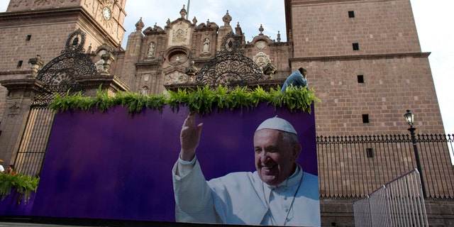 Feb. 15, 2016: Workers prepare Morelia's cathedral on the eve of Pope Francis' arrival, in the Mexican state of Michoacan.