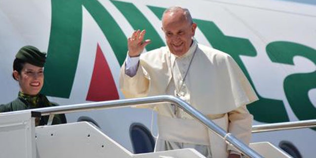 Pope Francis leaves for Poland with an Alitalia flight from the Fiumicino Airport in Rome, Wednesday, July 27, 2016. Pope Francis has departed for Krakow, where he will join World Youth Day, a major gathering of Catholics. (Telenews/ANSA via AP Photo)