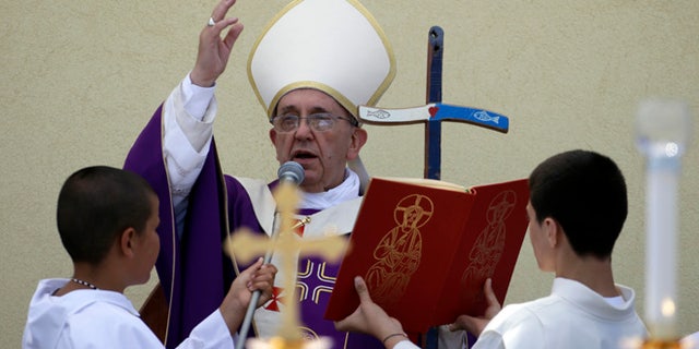 July 8, 2013: Pope Francis blesses faithful at the end of a Mass during his visit to the island of Lampedusa, southern Italy. Pope Francis traveled Monday to the tiny Sicilian island of Lampedusa to pray for migrants lost at sea, going to the farthest reaches of Italy to throw a wreath of flowers into the sea and celebrate Mass as yet another boatload of Eritrean migrants came ashore.