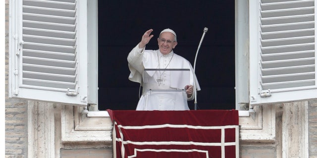 Feb. 5, 2017: Pope Francis waves from his studio window overlooking St. Peter's Square during his Angelus prayer at the Vatican