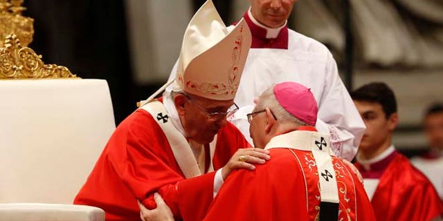 June 29, 2014: Pope Francis greets Monsignor Leonard Paul Blair, Archbishop of Hartford, Connecticut, after bestowing to him the Pallium, a woolen shawl symbolizing their bond to the pope, during a mass in St. Peter's Basilica, at the Vatican. (AP)