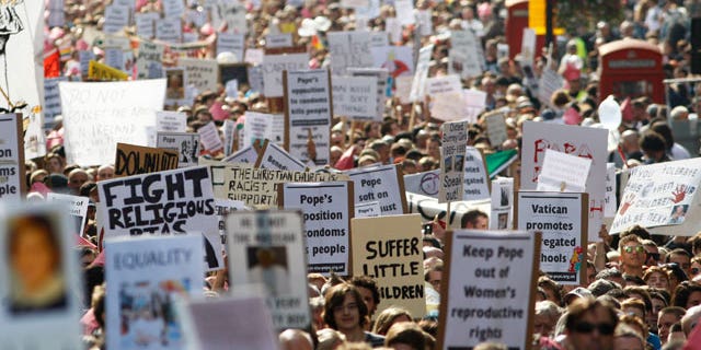 Thousands of people march through central London to protest against the State visit of Pope Benedict XVI to Britain, Saturday, Sept. 18, 2010. Pope Benedict XVI is on a four-day visit, the first-ever state visit by a Pope to Britain.
