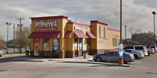 Police say a Texas father shot and killed a robbery suspect after he was threatened at this Popeye's restaurant in San Antonio, Texas.