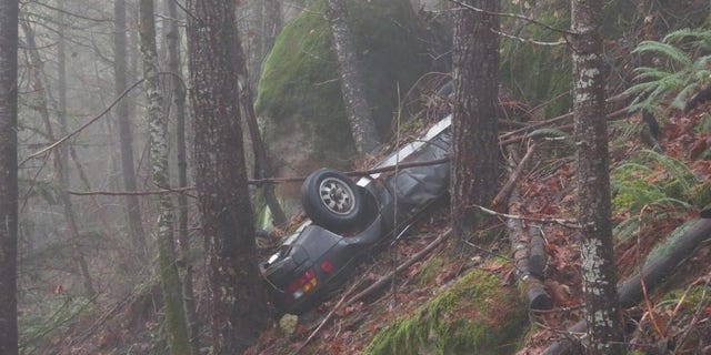 The Porsche had been hard to spot because of the position of the vehicle at the bottom of the cliff.