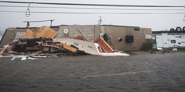 A trailer home sits on its side after Hurricane Harvey ripped through in Rockport, Texas, on Sat., Aug. 26, 2017.
