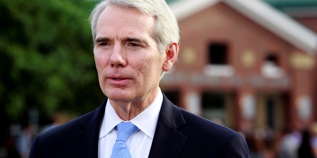 Sen. Rob Portman, R-Ohio, addresses the media outside the art center before a funeral service for Otto Warmbier, who died after his release from North Korea, at Wyoming High School in Wyoming, Ohio, U.S. June 22, 2017. REUTERS/John Sommers II - RTS18721