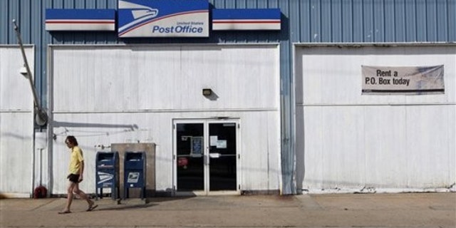 A man walks away from a post office July 27 in New Brunswick, N.J.