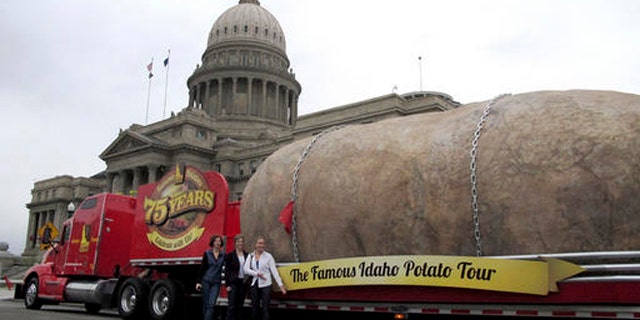 In this March 30, 2012, file photo, the Idaho Potato Commission displays its six-ton tuber replica on the street in front of the Idaho Capitol in Boise.