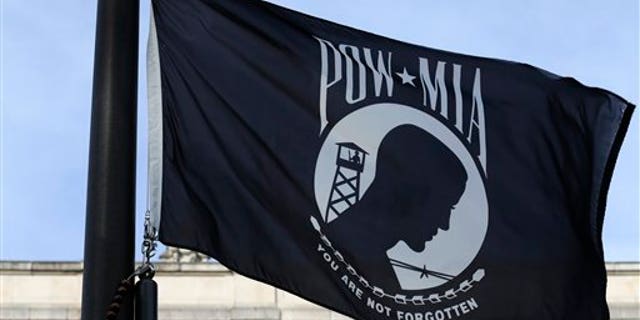 A POW/MIA flag flies Friday, Sept. 20, 2013, in Olympia, Wash., on National POW/MIA Recognition Day.