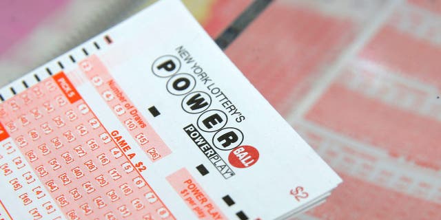 A Powerball ticket rests on a counter in a store in New York City, Feb. 22, 2017.