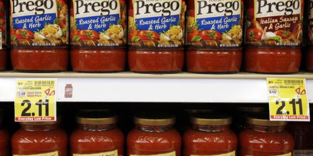 Jars of Prego sauce on a grocery store shelf (Reuters/Rick Wilking)